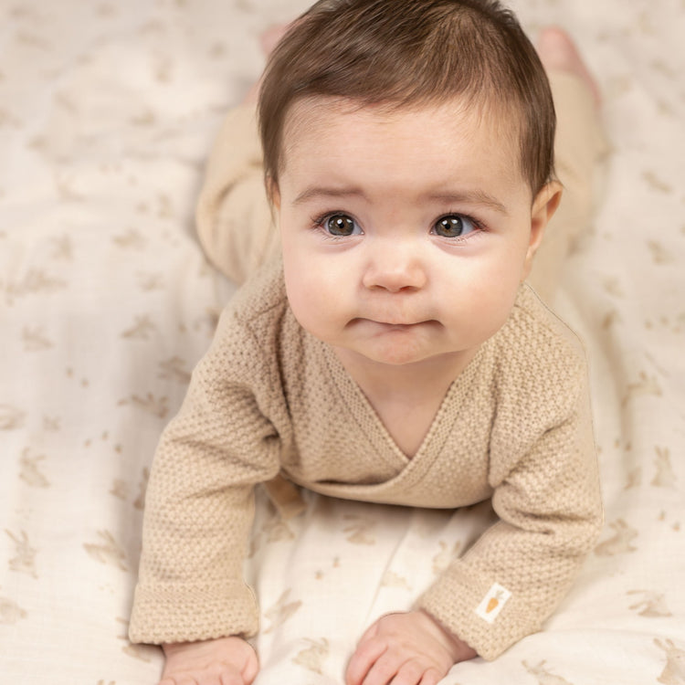 LITTLE DUTCH. Knitted one-piece wrap suit Sand